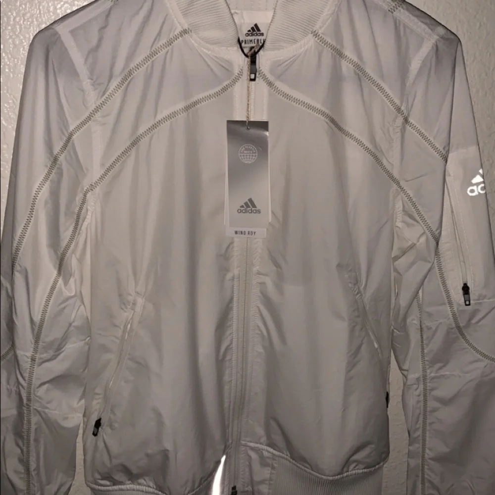 Adidas windbreaker/jacket, size small in woman, nylon texture, color white - Picture 1 of 2